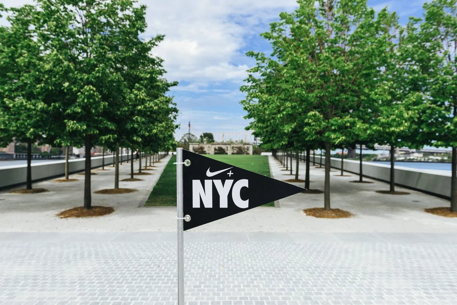 Nike NYC flag at a waterfront brand activation